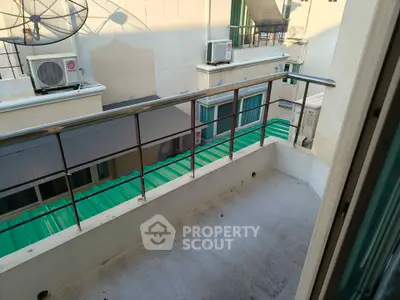 Charming balcony with urban view, perfect for relaxation and enjoying city life.