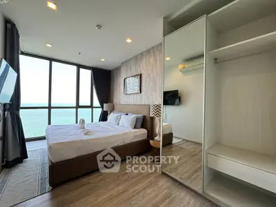 Luxurious bedroom with stunning ocean view and modern furnishings