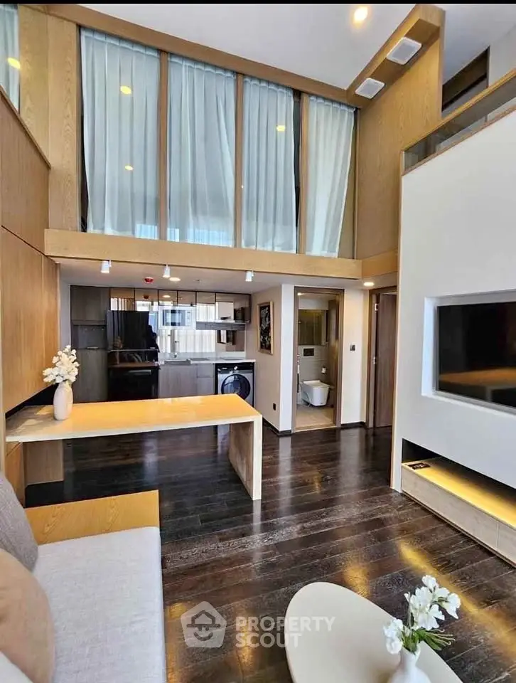 Stunning modern living room with high ceilings and elegant decor, perfect for luxury urban living.