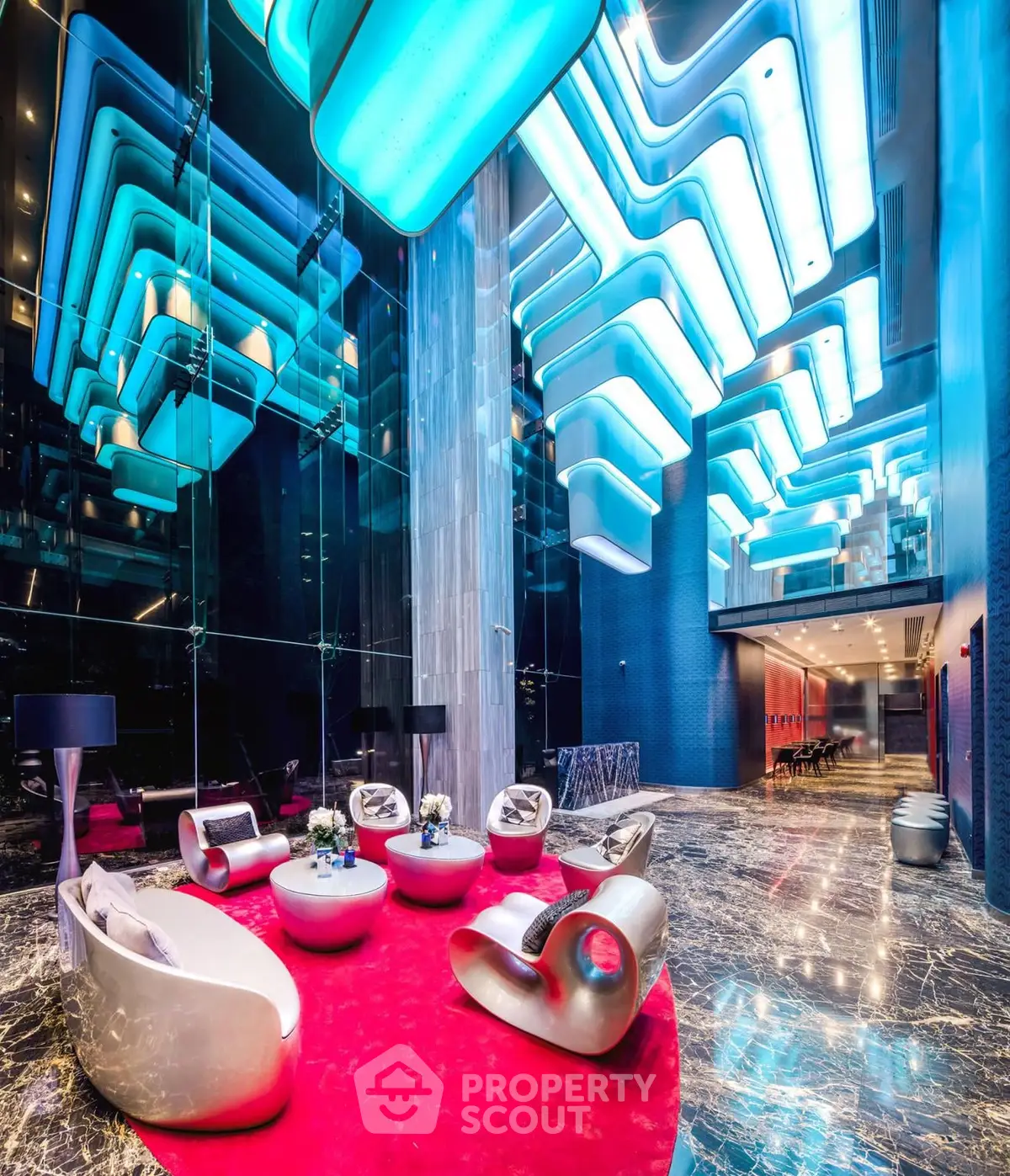 Stunning modern lobby with futuristic lighting and luxurious seating area.