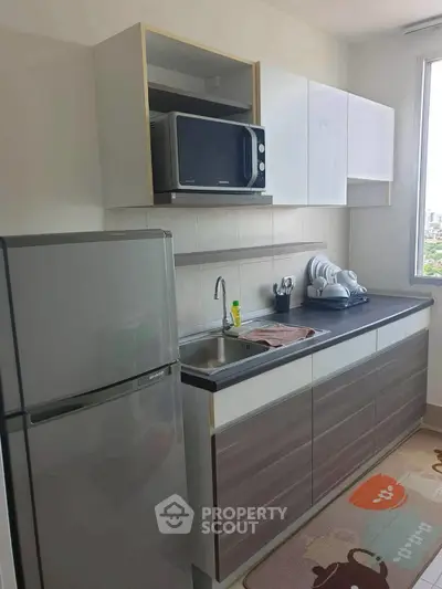 Modern kitchen with sleek cabinets and stainless steel appliances