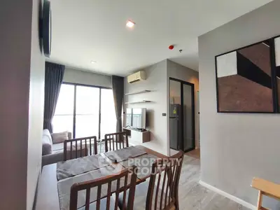 Modern living room with dining area and large window in stylish apartment