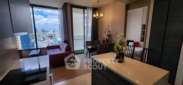 Luxurious open-plan living room with stunning city view and modern furnishings.