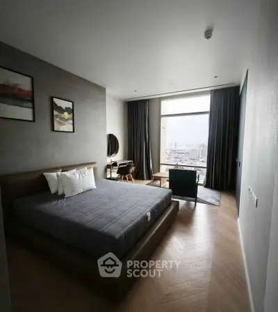 Luxurious bedroom with stunning city view, modern decor, and elegant furnishings.