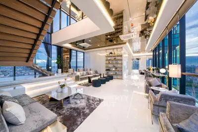 Luxurious penthouse living room with panoramic city views and modern decor