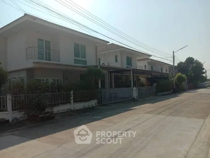 Charming suburban houses with modern design and spacious driveways in a peaceful neighborhood.