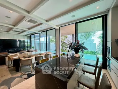 Luxurious open-plan living room with pool view and elegant dining area