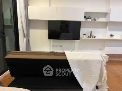 Modern living room with sleek TV setup and stylish shelving