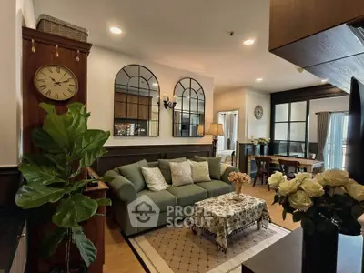 Charming living room with elegant decor, cozy sofa, and stylish wall mirrors in a modern apartment.