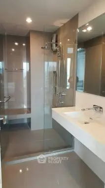 Modern bathroom with glass shower and sleek fixtures