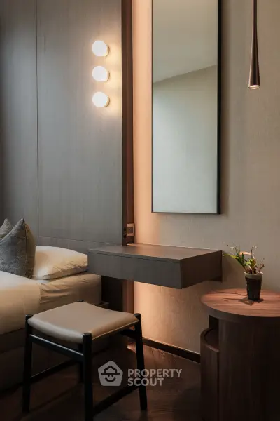 Elegant bedroom with modern lighting and stylish furniture
