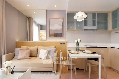 Modern living room with cozy sofa and stylish dining area in open layout apartment.