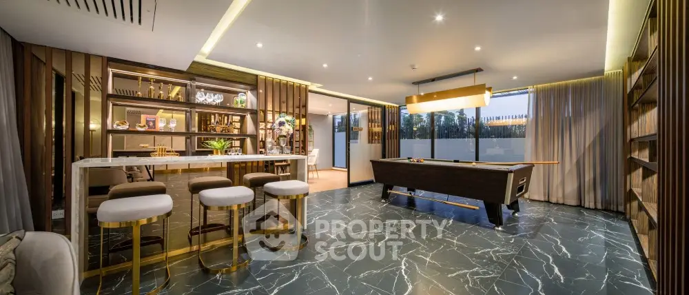 Luxurious modern living room with elegant bar and pool table, featuring marble flooring and ambient lighting.