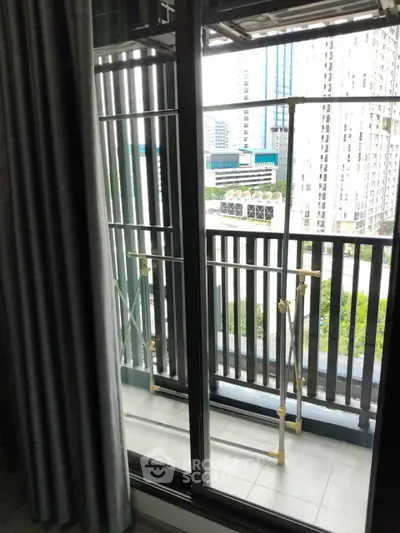 Modern high-rise balcony with city view and sleek railing design.