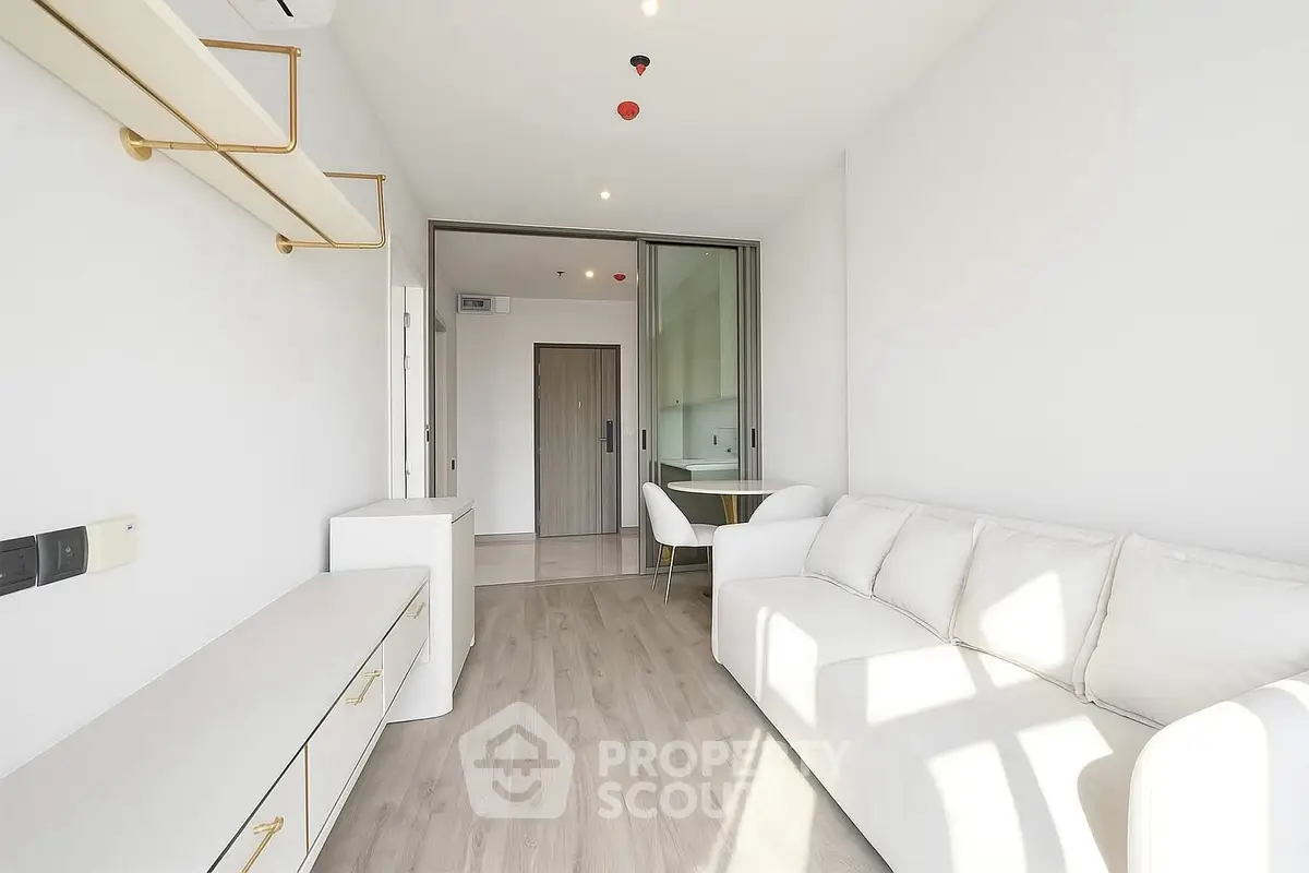 Modern minimalist living room with white sofa and sleek storage solutions