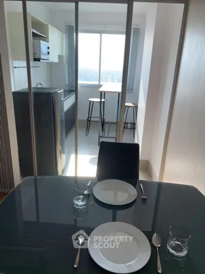 Modern kitchen with dining area and large window view