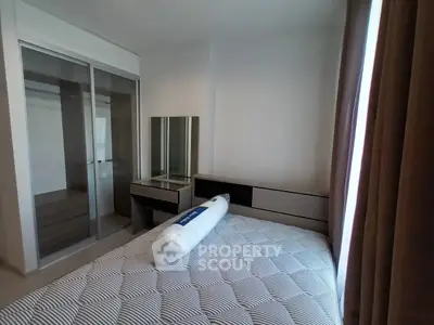 Modern bedroom with stylish furniture and ample natural light