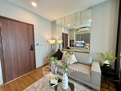 Modern living room with stylish decor and mirrored wall