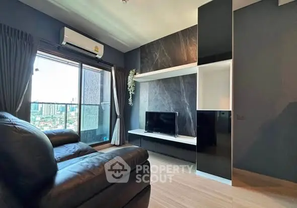 Modern living room with city view and sleek black furniture