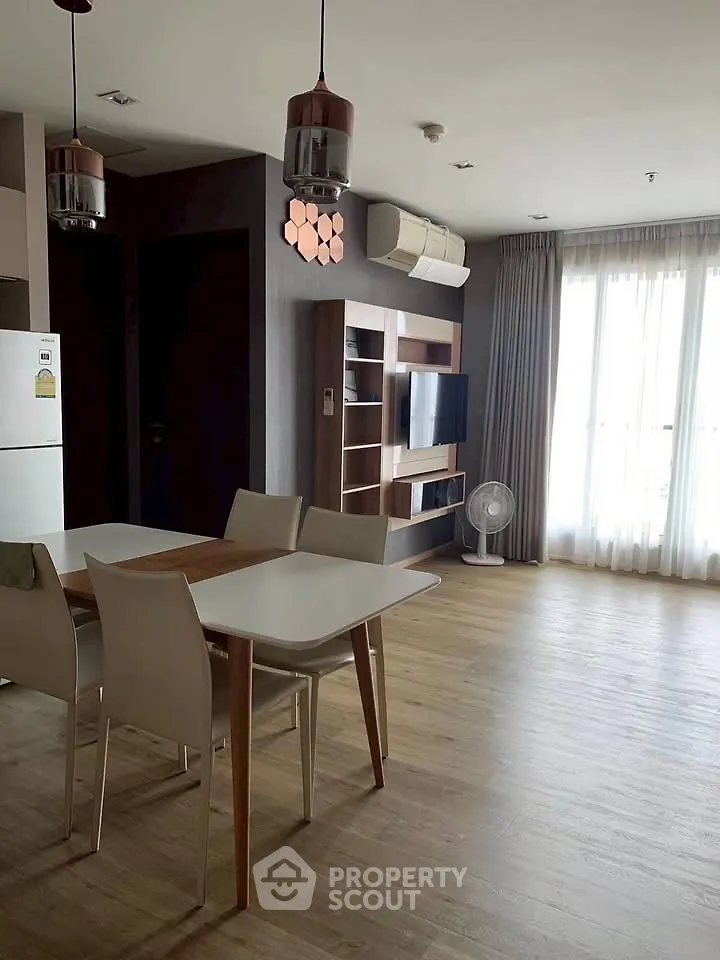 Modern living room with dining area and stylish lighting