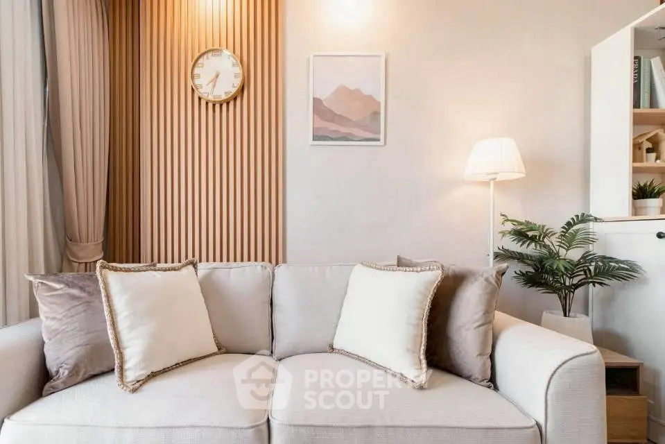 Elegant living room with cozy sofa and stylish decor, perfect for modern living.