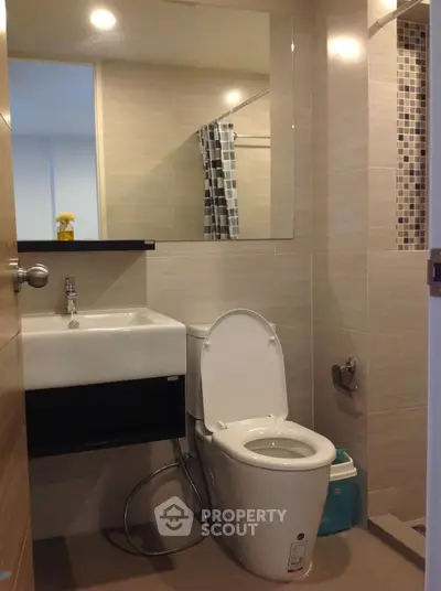Modern bathroom with sleek fixtures and stylish tile accents