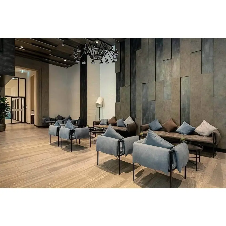 Luxurious modern lobby with stylish seating and elegant lighting in upscale building.