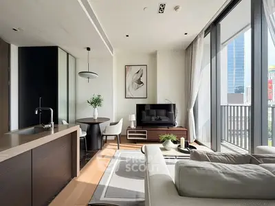 Modern living room with open kitchen and city view balcony