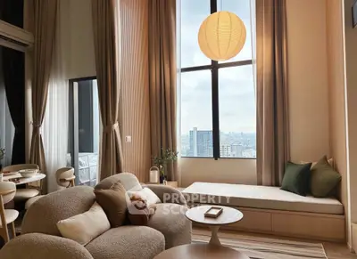 Luxurious living room with high ceilings and panoramic city view, featuring cozy seating and elegant decor.