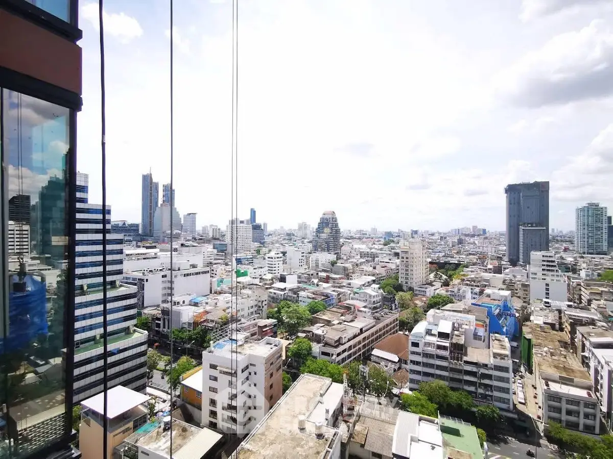 Stunning cityscape view from high-rise building with expansive skyline and modern architecture.