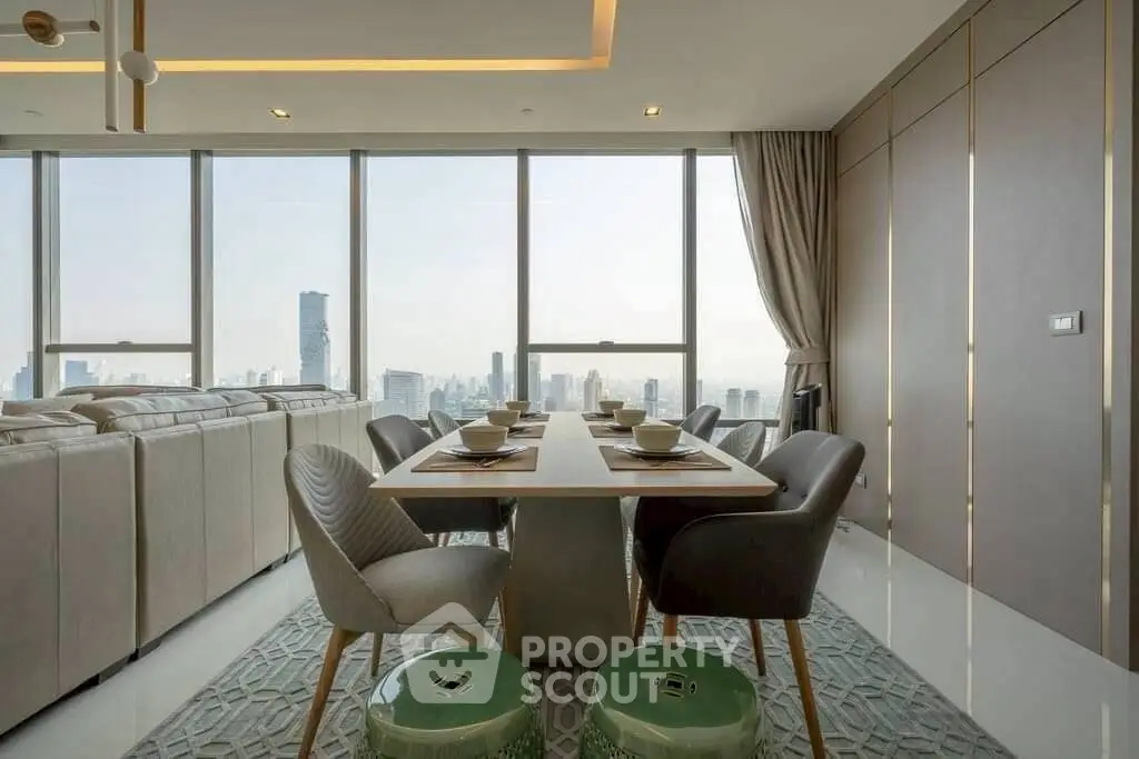 Luxurious dining area with panoramic city views and elegant furnishings.