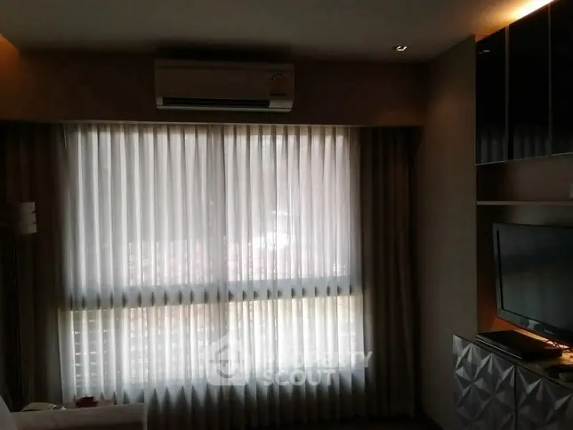 Cozy living room with air conditioning and modern decor