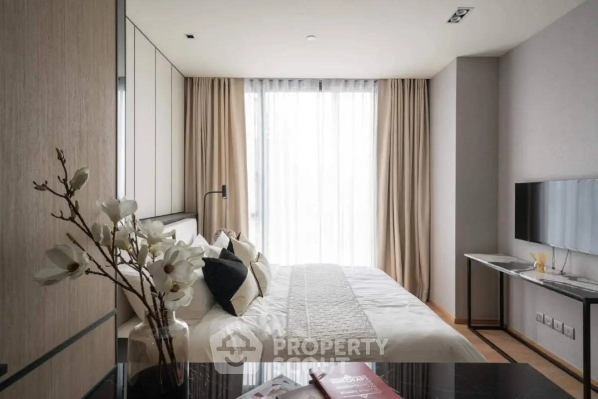 Modern bedroom with elegant decor and natural light