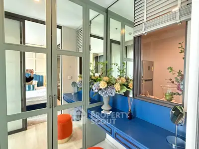 Stylish bedroom with mirrored closet and vibrant decor