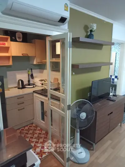 Charming compact kitchen with open layout and modern appliances in cozy apartment