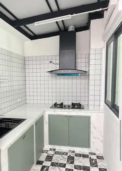 Modern kitchen with gas stove and stylish tile design, featuring sleek cabinetry and ample natural light.