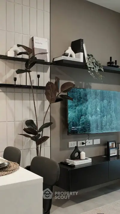Modern living room with stylish decor and wall-mounted TV