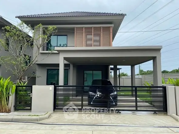 Modern two-story house with sleek design and spacious driveway