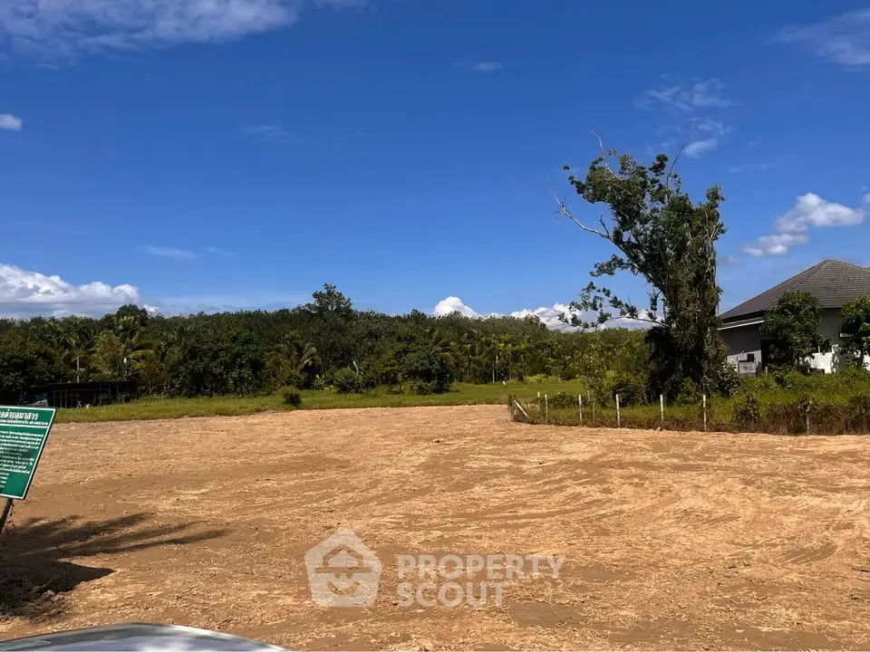 Spacious land plot with clear blue sky, ideal for development or investment opportunities.