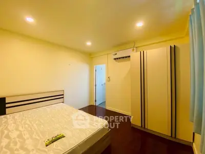 Cozy bedroom with modern wardrobe and ambient lighting