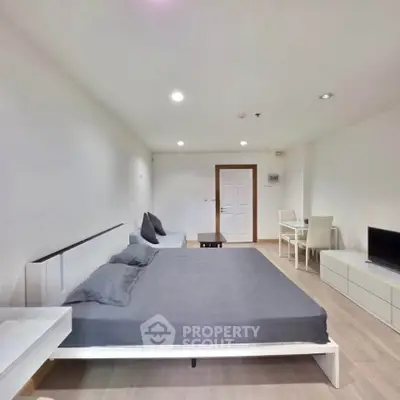 Modern studio apartment with minimalist design and cozy furnishings