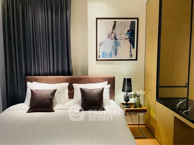 Elegant bedroom with modern decor, featuring a cozy bed, stylish artwork, and ambient lighting.