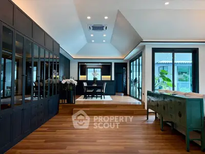 Luxurious modern living room with elegant wooden flooring and stylish furniture