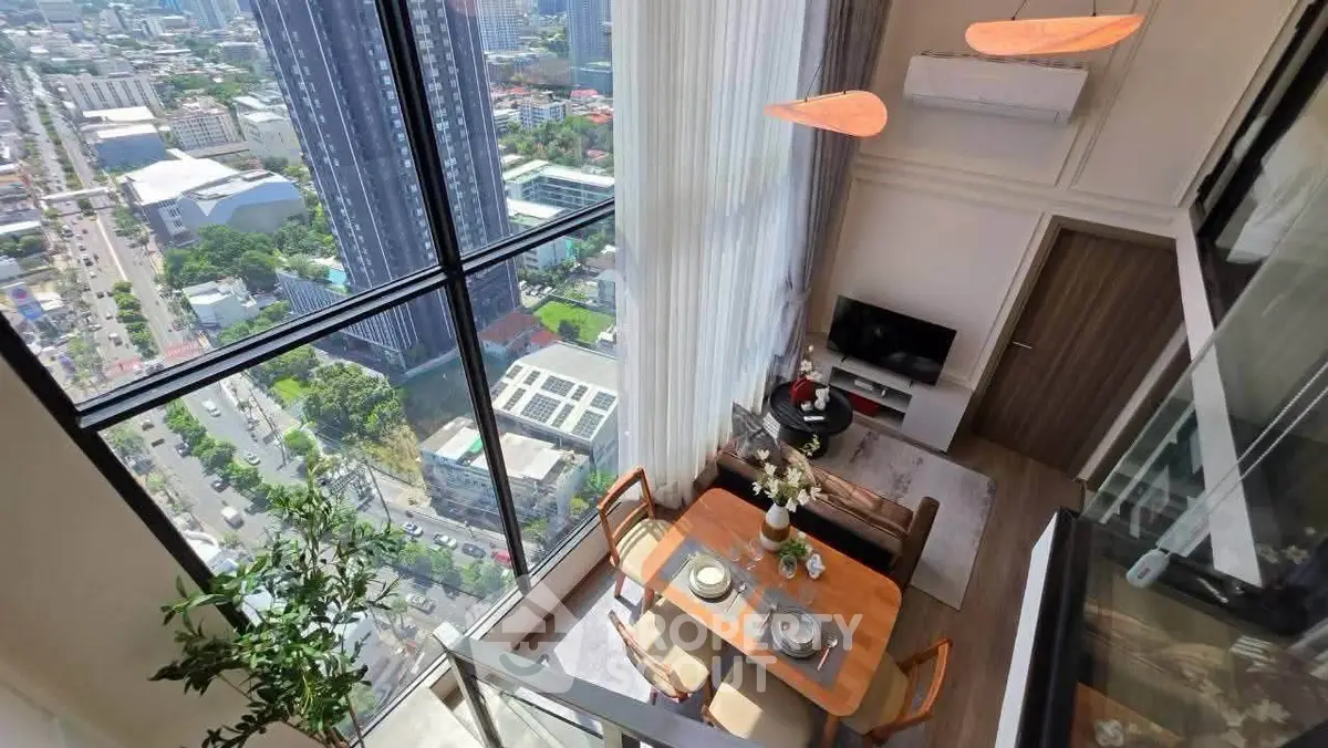 Stunning high-rise apartment with floor-to-ceiling windows offering breathtaking city views and elegant dining area.