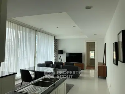 Spacious modern living room with open kitchen and large windows