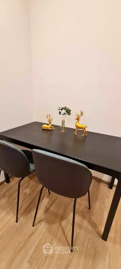 Stylish dining area with modern black table and elegant decor