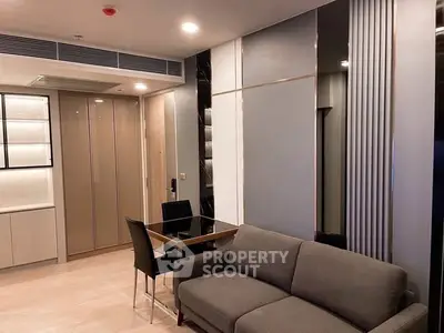 Modern living room with sleek furniture and stylish decor in a contemporary apartment.