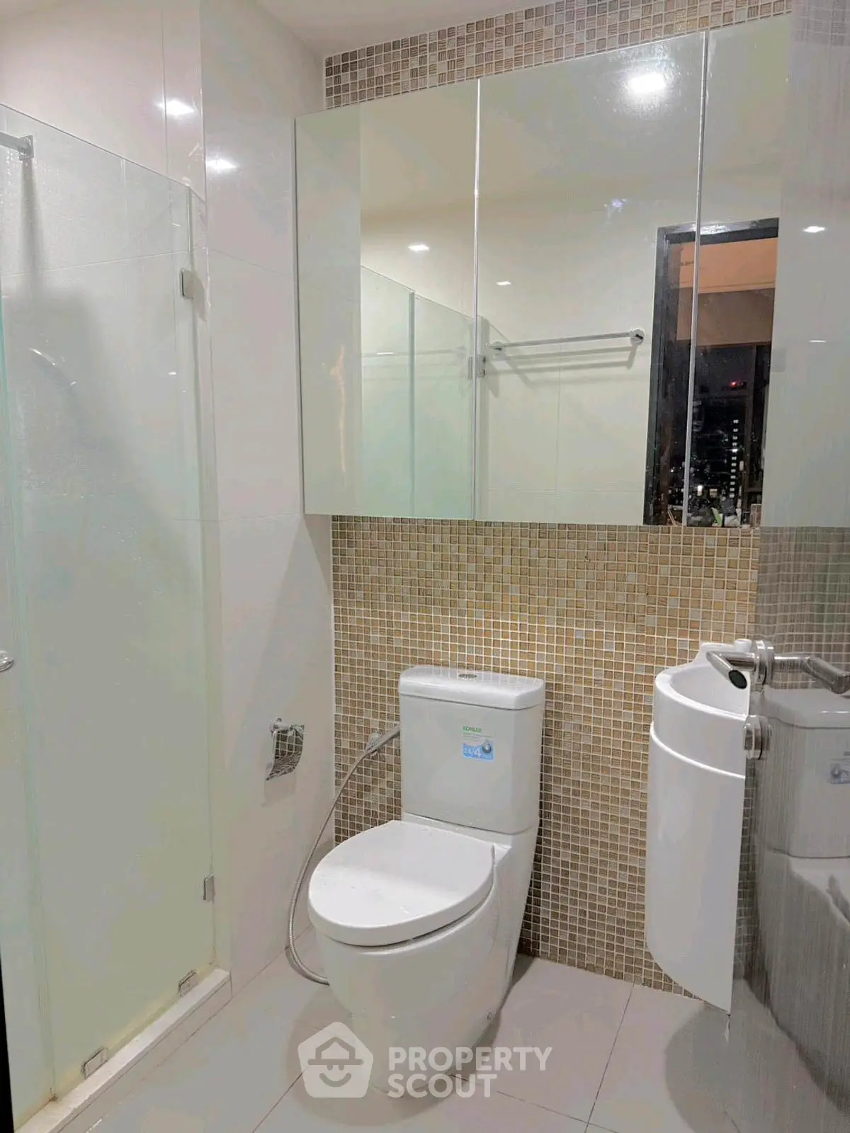 Modern bathroom with glass shower and sleek fixtures