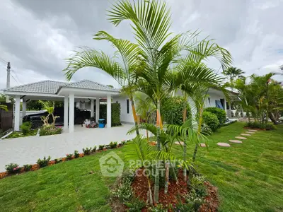 Charming single-story home with lush garden and carport, perfect for serene living.