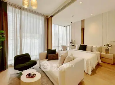 Luxurious modern bedroom with elegant decor and large windows